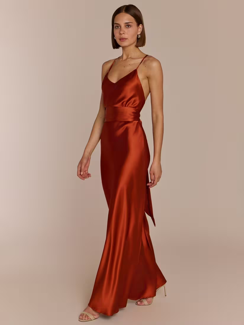 Elegant bridesmaid wearing REWRITTEN Brooklyn Bridesmaid Dress in Burnt Orange