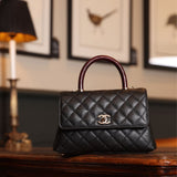 CHANEL Black Quilted Flap Bag with Top Handle