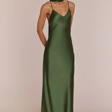Woman wearing a REWRITTEN Brooklyn Bridesmaid Dress in Olive Green