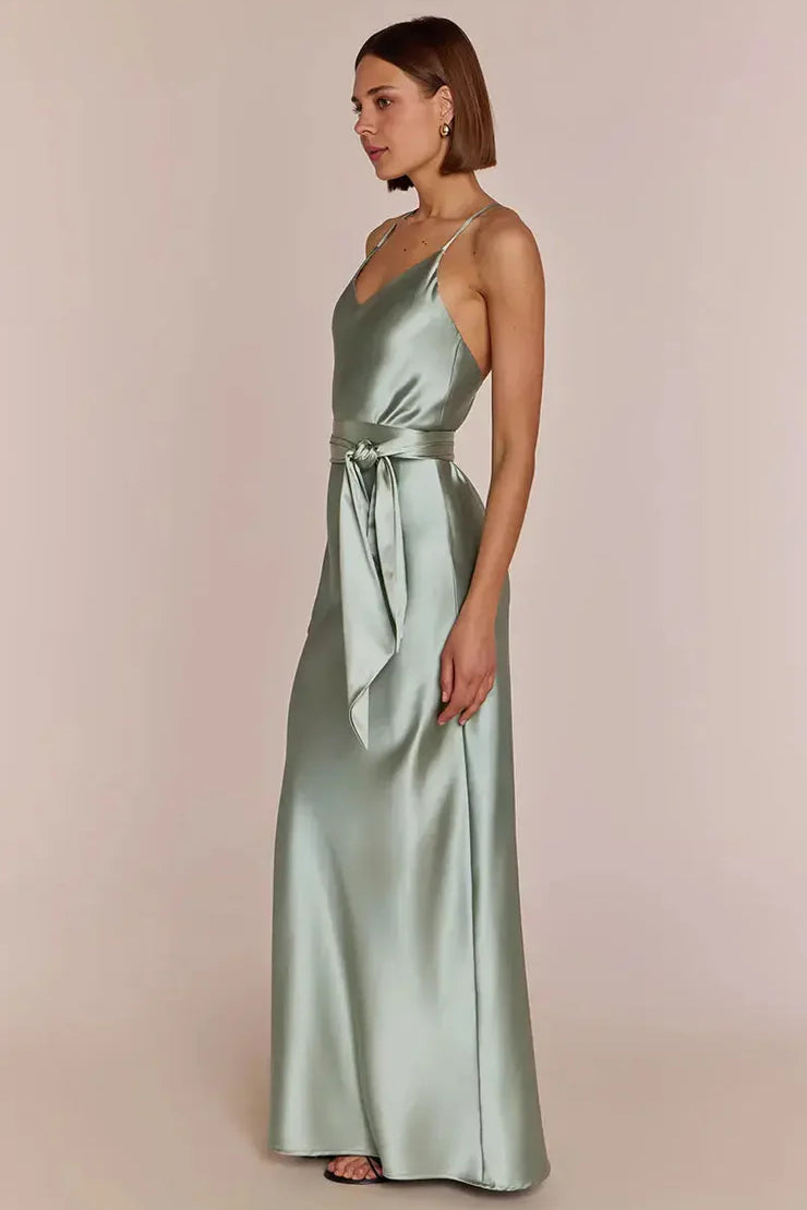 Right side-pose Woman wearing a REWRITTEN Brooklyn Bridesmaid Dress in Sage Green against a plain background