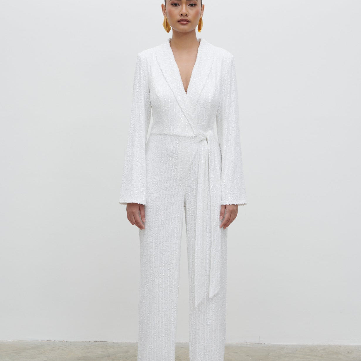 Chamonix sequin wrap jumpsuit, available to rent from Something Borrowed for weddings in Liverpool
